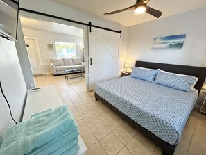 Private bedroom with barn door, king bed, smart HDTV