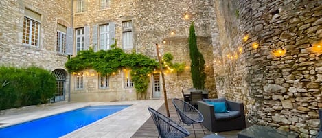 The stunning private courtyard with swimming pool, dining and lounge areas