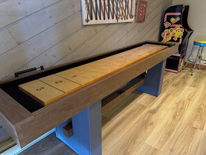 The Pac-Man machine and shuffleboard table will provide hours of fun!