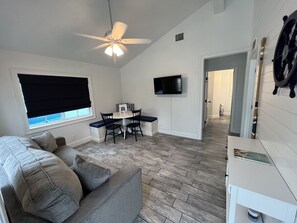 Living room w/ dining area and queen pullout couch