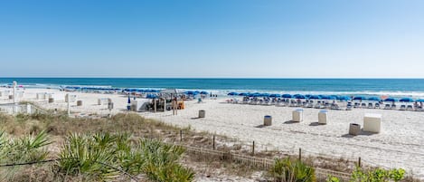 Dip your toes in the white sands off the Gulf just steps from the building