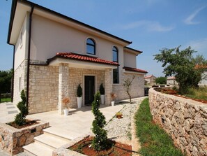 entrance and garden of the villa