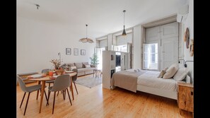 Overview of the studio, with a comfortable double bed, dining area that can accommodate four people and a spacious living area #stunning #modern