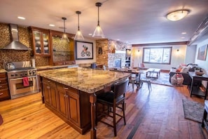 Kitchen features large central island.