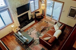 Cozy living room with fireplace and flat screen TV