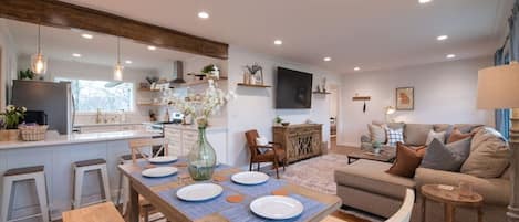 The Crossing House has a newly renovated kitchen, dining, and living room that all flows together.