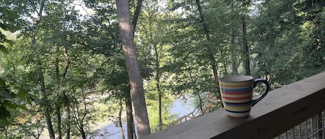 Enjoying a cup of coffee, while watching the river before anyone else is up