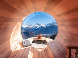 Ground floor, outdoor - Enjoy the warmth of a sauna session while gazing at the snowy peaks.