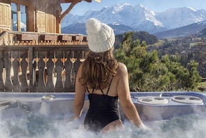 Ground floor, exterior - In all seasons, enjoy the large Jacuzzi strategically placed facing the highest peak in Europe.