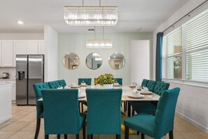 Elegant dining space with plush seating, chic décor, and perfect for group gatherings!