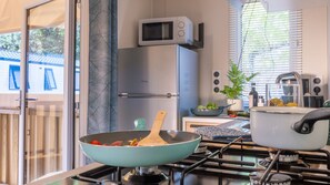 Feed your hunger with a satisfying meal cooked in your kitchenette.