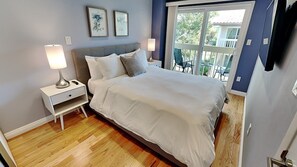 Bedroom Two with Queen Bed, Patio, and TV