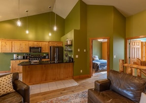 The living area is located upstairs. High vaulted ceilings create a great open concept.