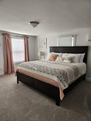 King sized bed in main bedroom
