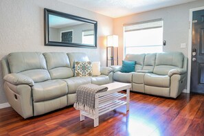 Living room in our License to Chill, Largo vacation rental with heated pool.