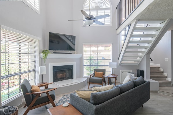 A cozy living room with comfortable sofa and couches for your whole group!