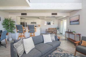 Comfortable and spacious living room seating and our 2-seater kitchen bar