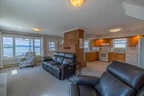 Living area leading into large kitchen where you will enjoy some of the best views of Claytor lake