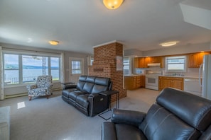 Living area leading into large kitchen where you will enjoy some of the best views of Claytor lake