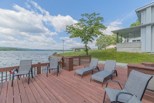 Dock seating where you will relax and sunbathe just steps from the front patio
