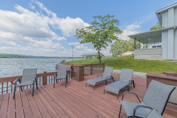Dock seating where you will relax and sunbathe just steps from the front patio