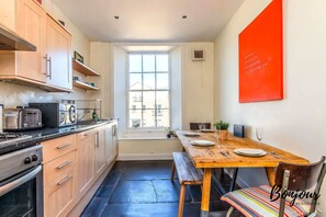 Working kitchenette and dining space for four.