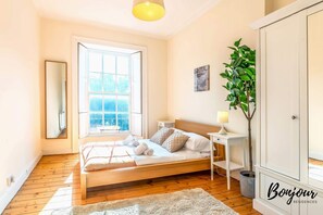 Bright and spacious bedroom with a king size bed