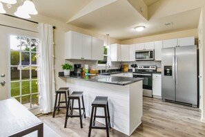 Cook up a storm in our fully stocked kitchen with stainless steel appliances.