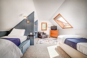 Loft space sleeps 3. Beds have personal lighting and charging stations.