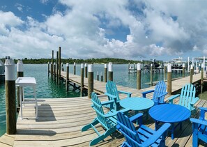 STARFISH BAY and MERMAID COVE - Large private and protected docks with fish cleaning station. Enjoy the guest seating area.