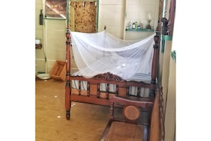 Bed with mosquito nest