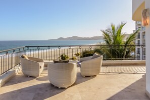 Patio with beachfront and ocean views