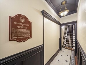 Indoors,Corridor,Floor,Flooring,Light Fixture