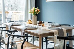 Comfortably seat up to six guests at our stunning wooden table and enjoy a delicious meal in a warm and inviting atmosphere.