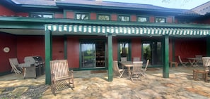 Back Patio with plenty of patio furniture and a view of the pond.