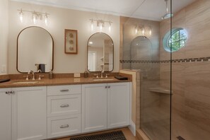 Main level bathroom with large walk-in shower with double vanitys