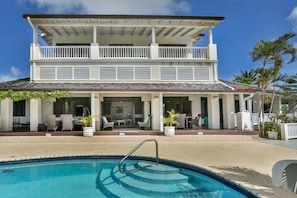 Villa and pool with lots of outdoor space.