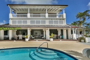 Villa and pool with lots of outdoor space.