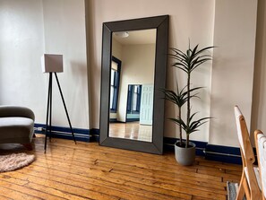 A Sparrow Arhaus floor mirror on the third floor