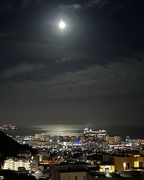 The moon shining over Cabo from the balcony