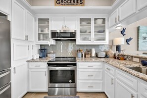 Equipped with cooking and baking basics, dinnerware, flatware, and serving dishes