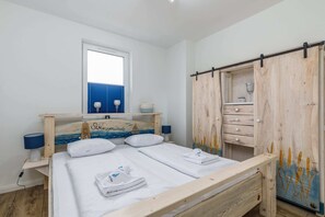 The bedroom's tasteful decor combines functionality with elegance. 