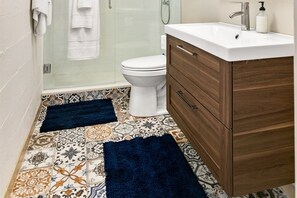 House 1: Downstairs remodeled bathroom with shower.