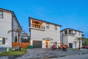 AT YOUR LEISURE is a 3 story home with over 3,000 sq feet of luxury accommodations that sleep up to 14 guests and includes a 6-seater golf cart with every booking