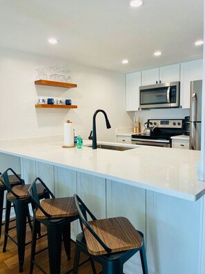 Newly renovated kitchen in Nov 2024 - granite countertops, new cabinets, new appliances. 