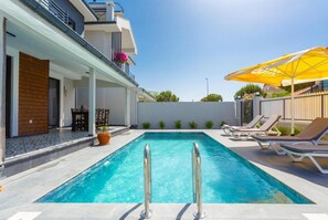 Private pool, terrace, and outdoor dining area