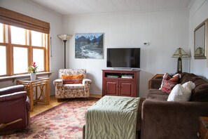 The living room is a great spot to cozy up, enjoy a glass of wine and watch a movie after a day at the beach.