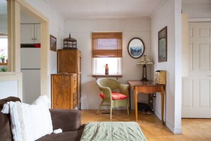 The Cobourg Creek Cottage is set up with wifi and a spacious desk for those looking to work remotely in a cozy space.