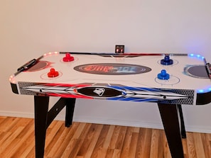 The young at heart can take the room with the Air Hockey table, located in the master bedroom.