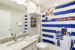 Upstairs kids bathroom located in bedroom